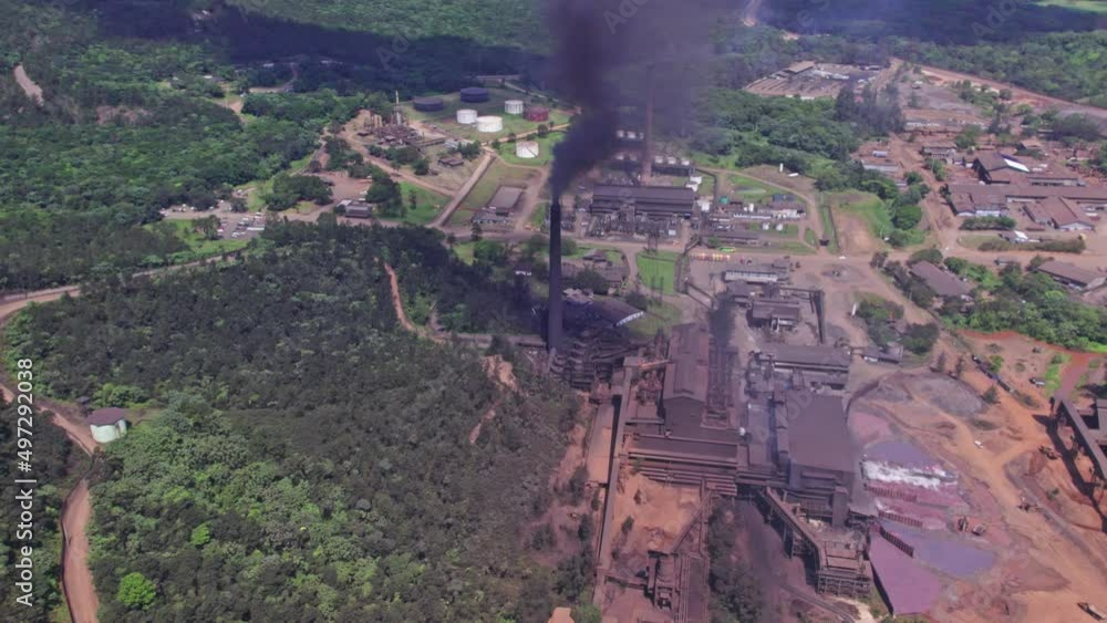 Aerial view of dark toxic smoke rising up from stack of mine plant in Dominican Republic - Sad environmental Pollution of earth Aerial view of dark toxic smoke rising up from stack of mine plant in Dominican Republic - Sad environmental Pollution of earth