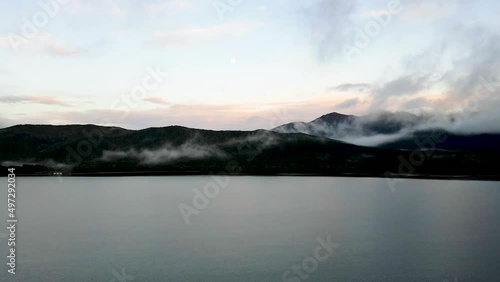 Wallpaper Mural Timelapse of a drone shot of a beautiful reflecting lake at sunset in New Zealand. Flying over the water, clouds moving while hanging low in the background, 4K. Torontodigital.ca