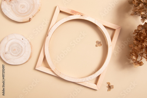 Flat monochrome composition for text or products. top view wooden geometric decor and saw cut.
