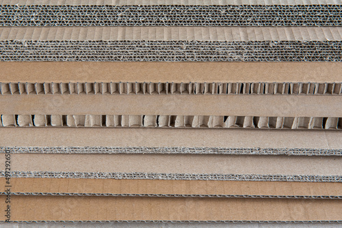 A stack of corrugated cardboard of various thicknesses