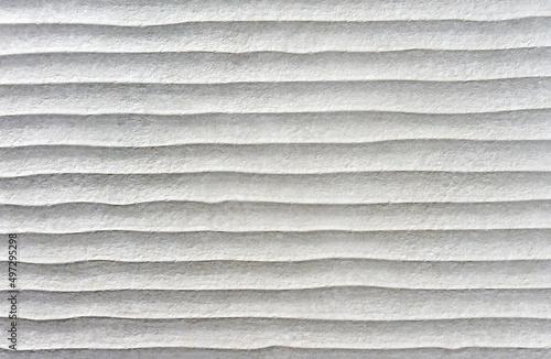 Gray ceramic tiles with wavy effect. Rough ceramic tile texture.