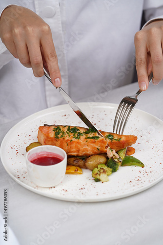 Grilled salmon and baked vegetable on a white plate