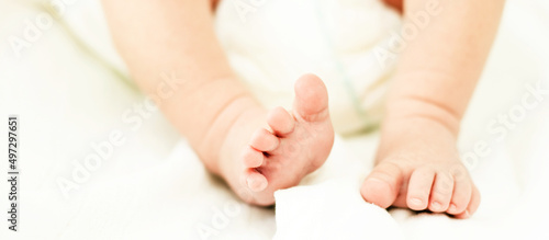 Newborn Baby Feets. Tiny Child Feet  Maternity  Birth  Childcare. Closeup View. Banner Design. 