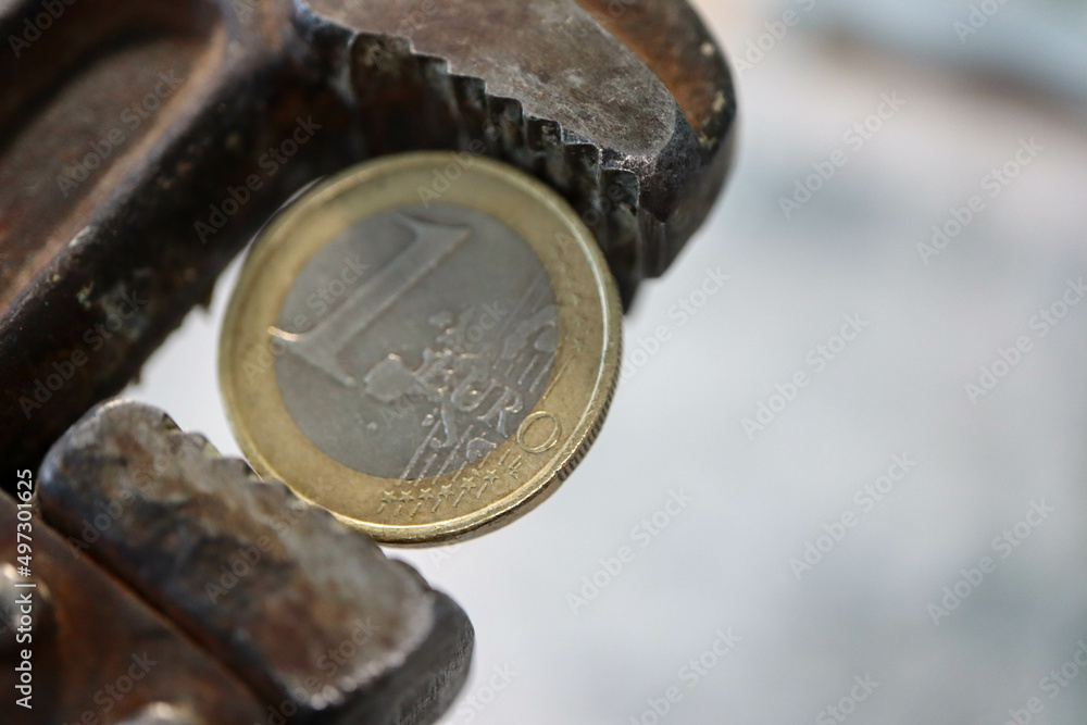 one euro coin in pincers - sanctions against russia from europe wallpaper one euro coin in pincers - sanctions against russia from europe wallpaper