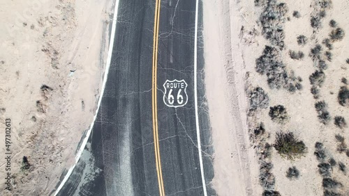 Straight down aerial view of the famous US Route 66 near the desert town of Barstow, California - sign painted on the highway asphalt photo