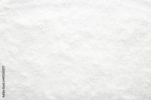 White dry sea salt background. Top view. Empty place for text. Top down view.