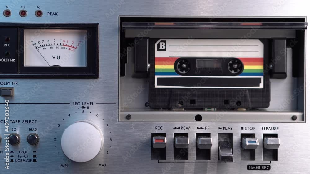 B Side of Old Cassette Tape Playing in Vintage Deck Player and Recorder, Close Up B Side of Old Cassette Tape Playing in Vintage Deck Player and Recorder, Close Up