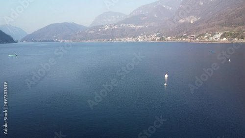 aerial footage of the fantastic waters of Capolago lake in 4k photo