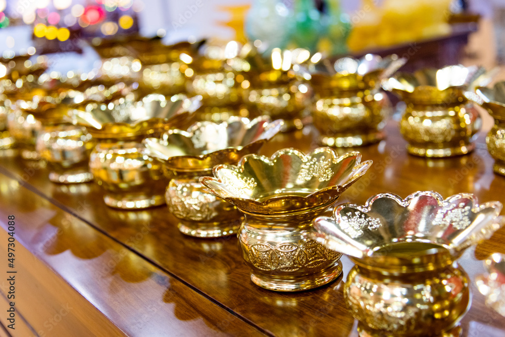 Gold candlesticks on the table Gold candlesticks on the table