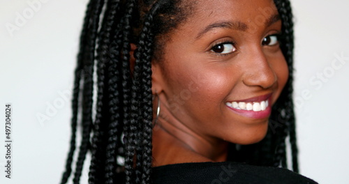 Pretty black African girl posing to camera. Teenager young woman portrait