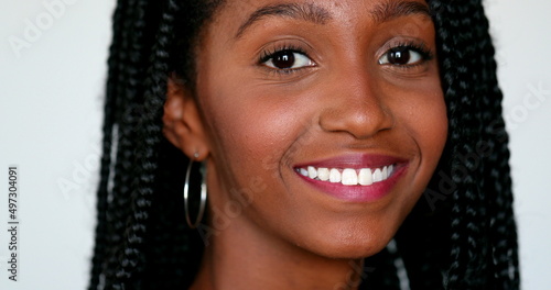 Pretty black African girl posing to camera. Teenager young woman portrait