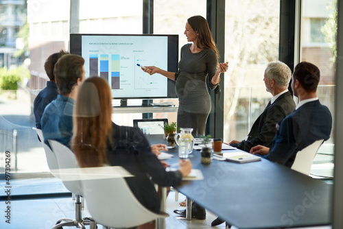 Taking stock and setting new targets. Shot of a corporate businessperson giving a presentation in the boardroom.