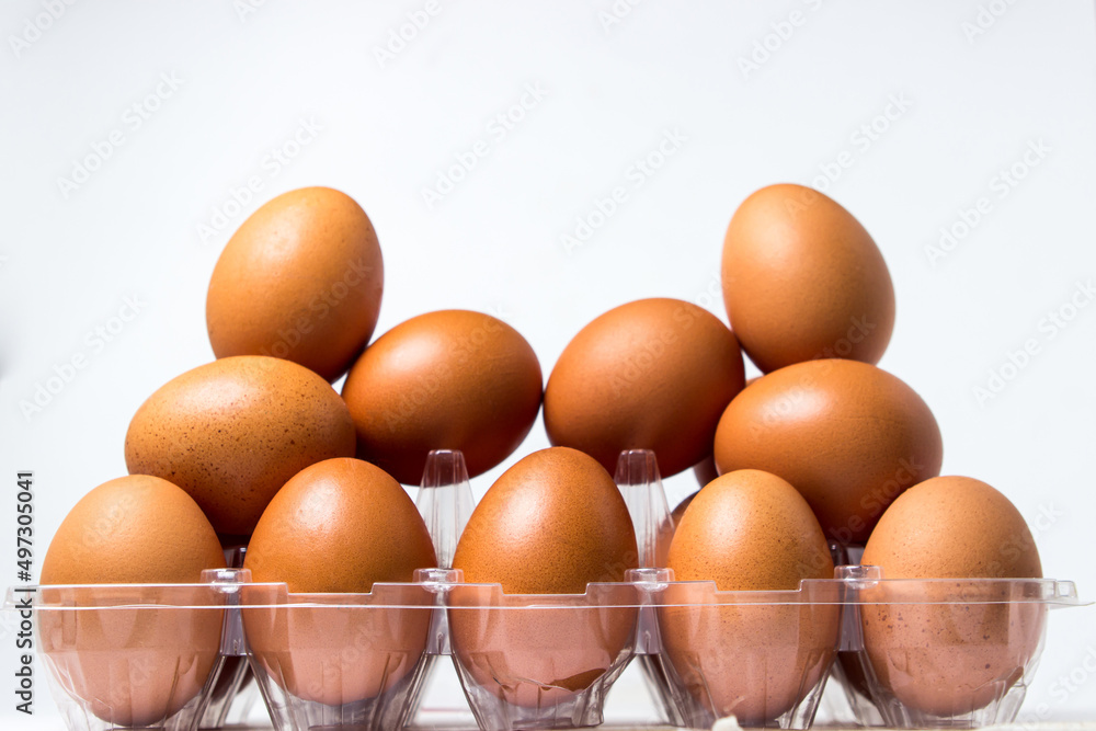 Lots of chicken eggs on a white background. Raw chicken eggs. Lots of chicken eggs on a white background. Raw chicken eggs.