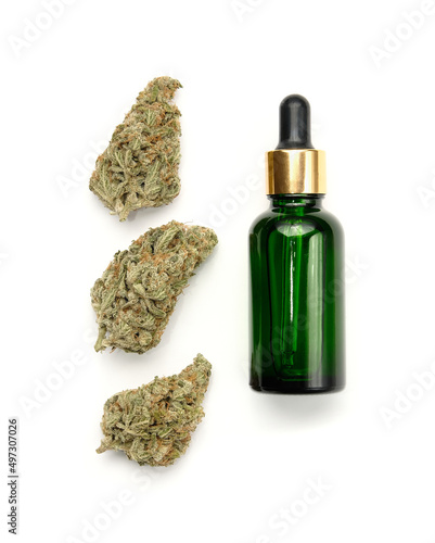 Marijuana cosmetic products, CBD oil. Medicinal hemp extract in cosmetic bottle, layout on white background, isolated. Natural herbal care, medical usage, cannabis therapy.