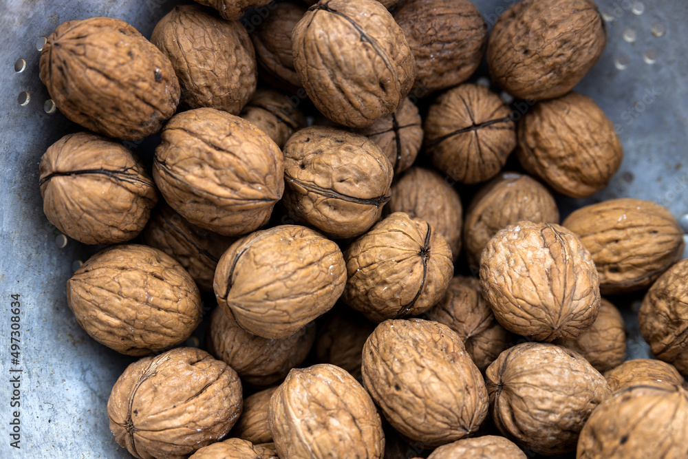 Plate full of walnuts close up full frame Plate full of walnuts close up full frame