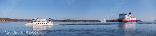 Fotografie Cruise ferries from Finland and an archipelago commuting boat arriving a sunny s