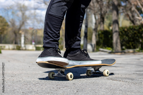 Close-up of a legs on a skateboard 