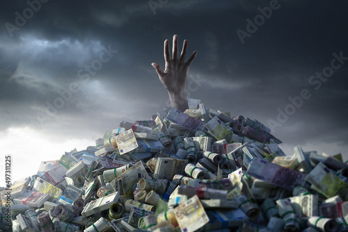 Person in a heap of money photo