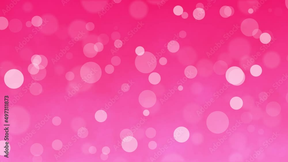 Sparkling bubbles float on a 4K pink background. Sparkling bubbles float on a 4K pink background.