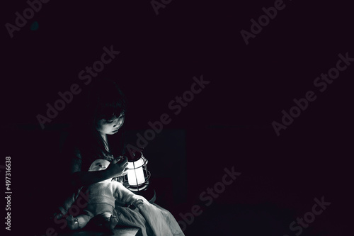 sad child ghost at night,Halloween  Festival concept,Friday 13th,Horror movie scene,A girl with doll