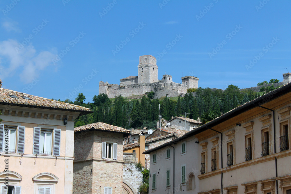 The Rocca Maggiore of Assisi on the top of the hill overlooking the houses below