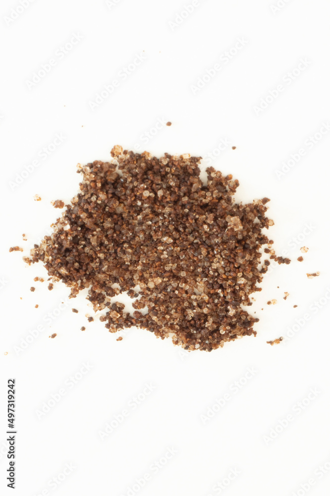 Brown texture scrub with cocoa coconut and coffee on white background. spa and home care concept, beauty procedures, vertical photo Brown texture scrub with cocoa coconut and coffee on white background. spa and home care concept, beauty procedures, vertical photo