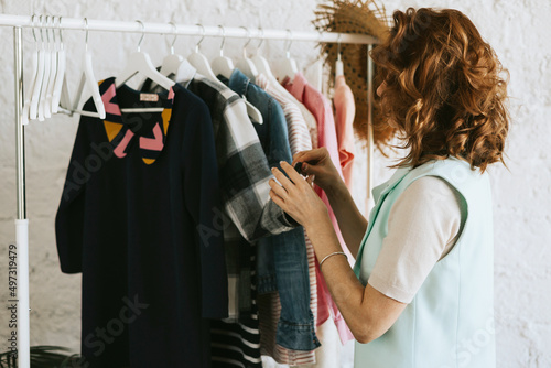 Wallpaper Mural middle aged woman female woman at swap party try on clothes, bags, shoes and accessories, change clothes, second hand garment, zero waste life, eco-friendly approach to consumption, diverse people Torontodigital.ca