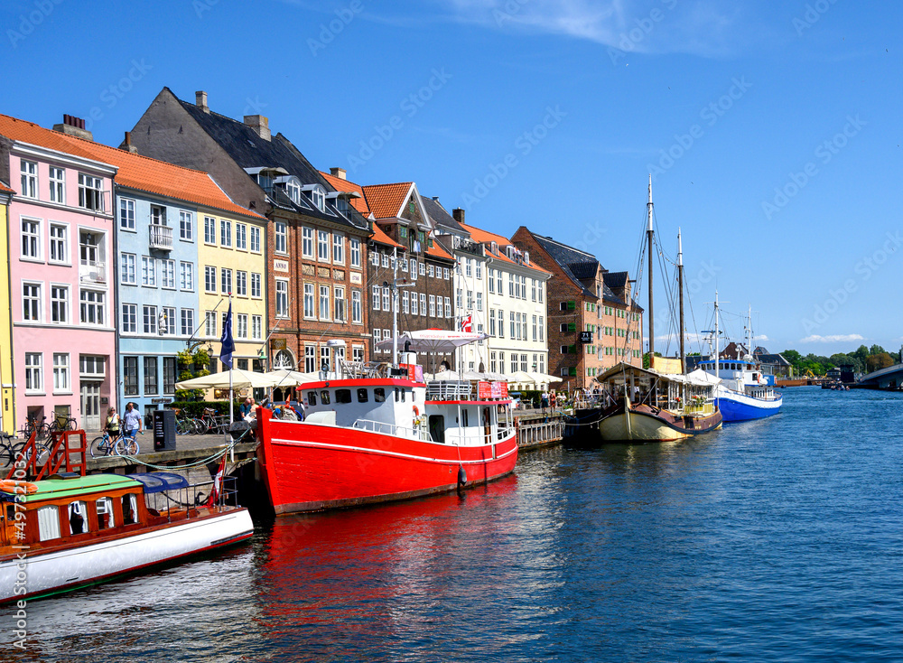 Colorful facade and boats on the Nyhavn Canal, in Copenhagen Denmark