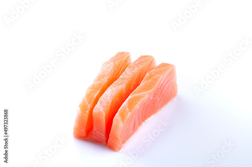 three pieces of raw salmon sashimi sushi japanese food close up cut angle isolated on white background