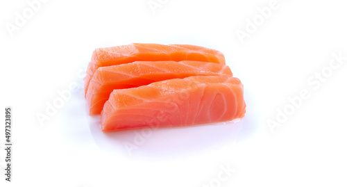 three pieces of raw salmon sashimi sushi japanese food closeup isolated on white background