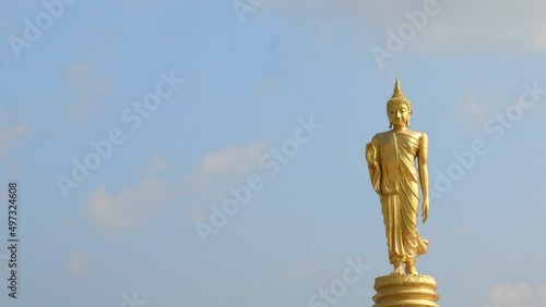 The standing buddha with blue sky in Thailand  ,Copy space 