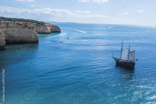 Fototapeta Naklejka Na Ścianę i Meble -  Portuguese Pirate Ship Sailing around Benagil Cave