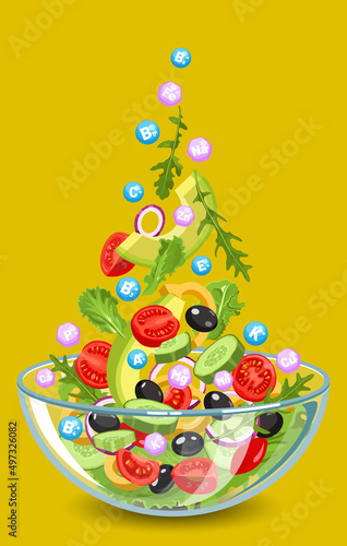 Fresh vegetable salad full of vitamins and minerals in a glass bowl. Arugula, lettuce leaves, tomatoes, cucumbers, onions rings, avocado, olives, pepper

