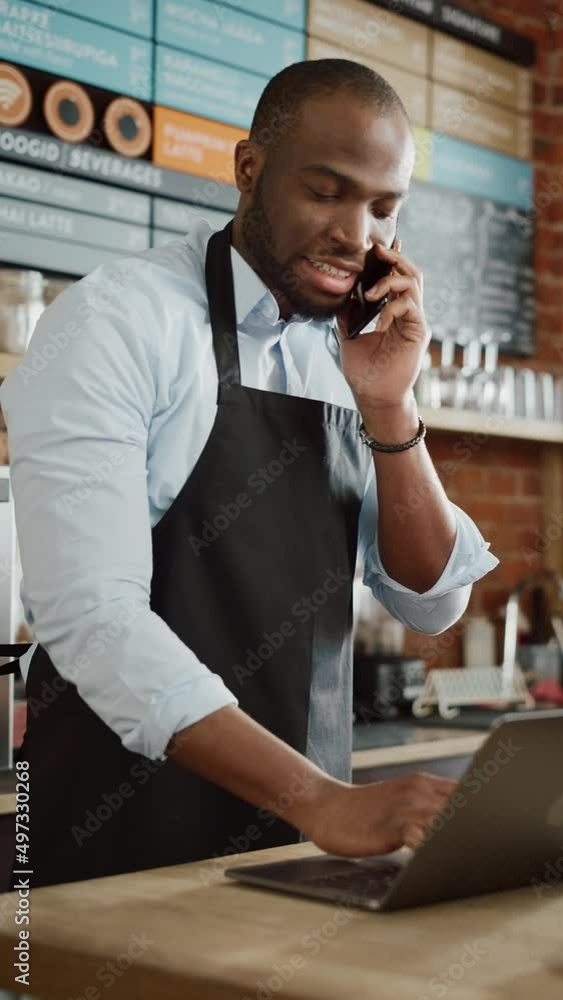 Vertical Footage of Black African American Coffee Shop Employee Accepts