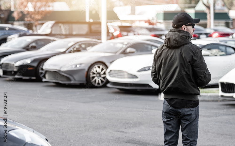 Caucasian Men Looking For New Exotic Vehicle Caucasian Men Looking For New Exotic Vehicle