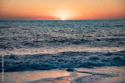 Fototapeta Naklejka Na Ścianę i Meble -  The sea wave. Sunset in the sea. The power of the elements.