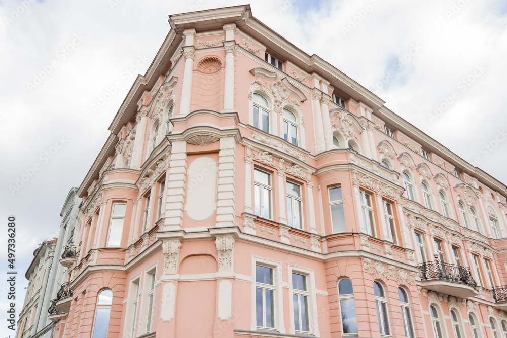 Facade of pink old tenement residential house in Bydgoszcz city, Old port Street, Poland. Historical architecture.