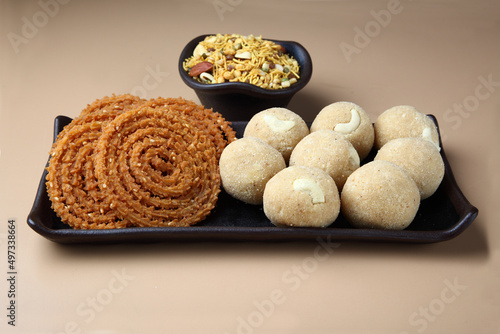 Diwali festival snacks or diwali food or diwali sweets ,diwali snacks chakali or chakli, laddu  photo
