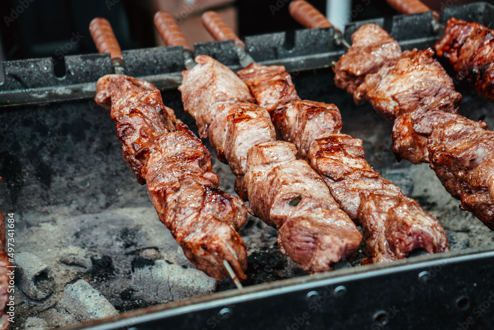 meat skewers are fried on the grill or shish kebab cooked on hot coals