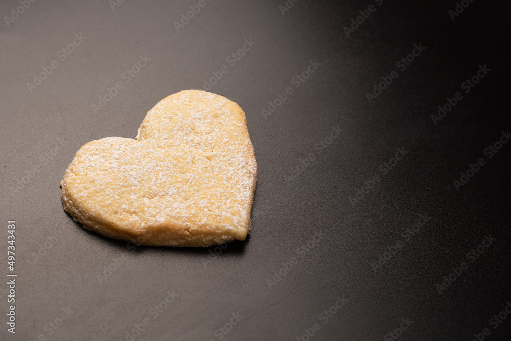 Shortbread in the shape of a heart isolated on white background. Shortbread in the shape of a heart isolated on white background.
