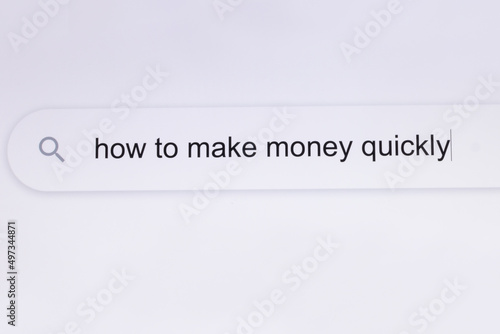 How to make money quickly - internet browser search bar question typing text. Typing the word How to make money quickly in the browser on a pixelated computer screen.