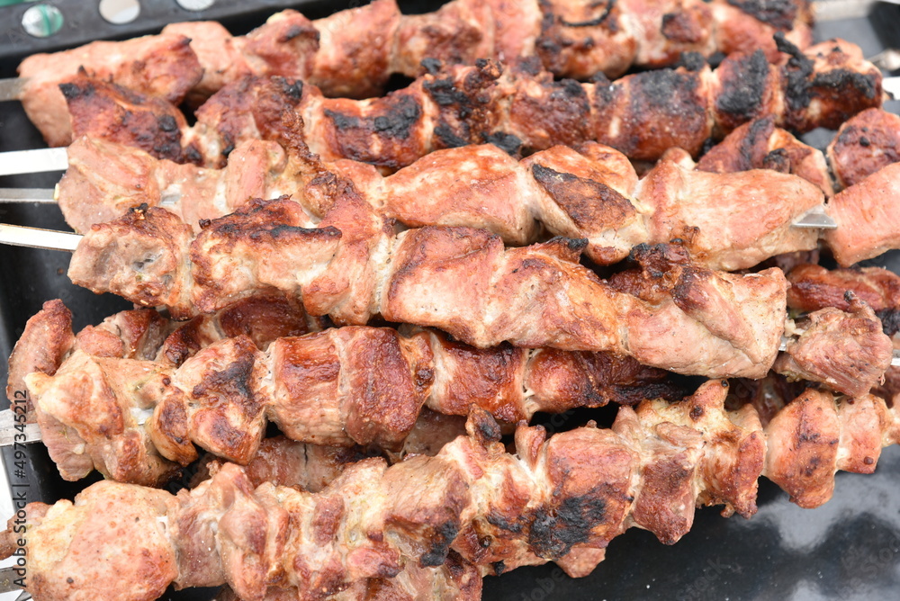 Pork meat shish kebab on a fire on coals