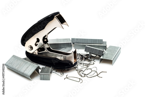 Anti-stapler with clerical staples on a white background. Stationery. stapler photo