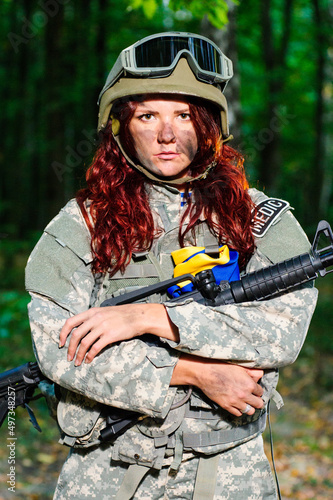 Ukranian female soldier in the forest