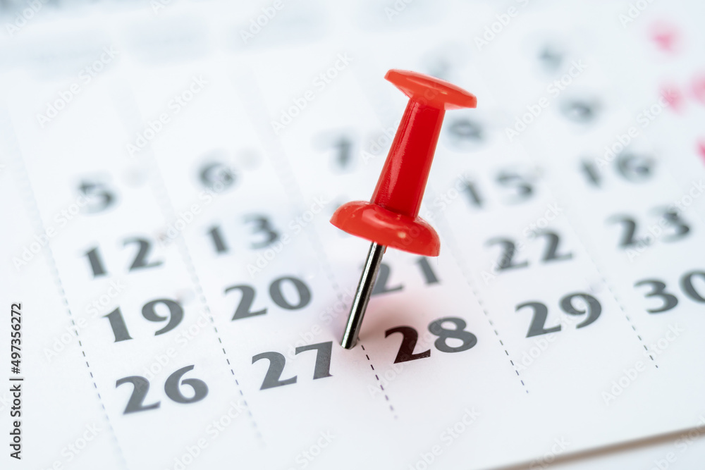 Red push pin on calendar 27th day of the month, mark the Event day with a Pin. Pin on calendar day twenty seven, date number 27. Twenty seventh day of the month is marked with a red thumbtack Red push pin on calendar 27th day of the month, mark the Event day with a Pin. Pin on calendar day twenty seven, date number 27. Twenty seventh day of the month is marked with a red thumbtack