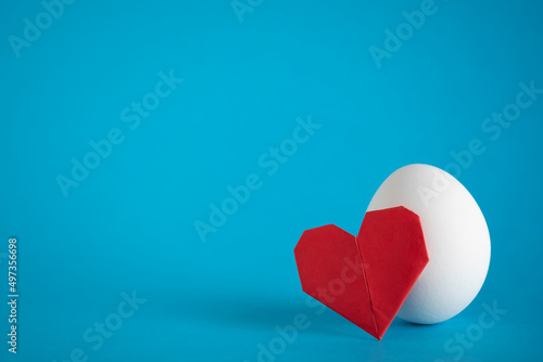 Egg love concept.  Heathy food idea. Egg and paper heart still life. Copy space