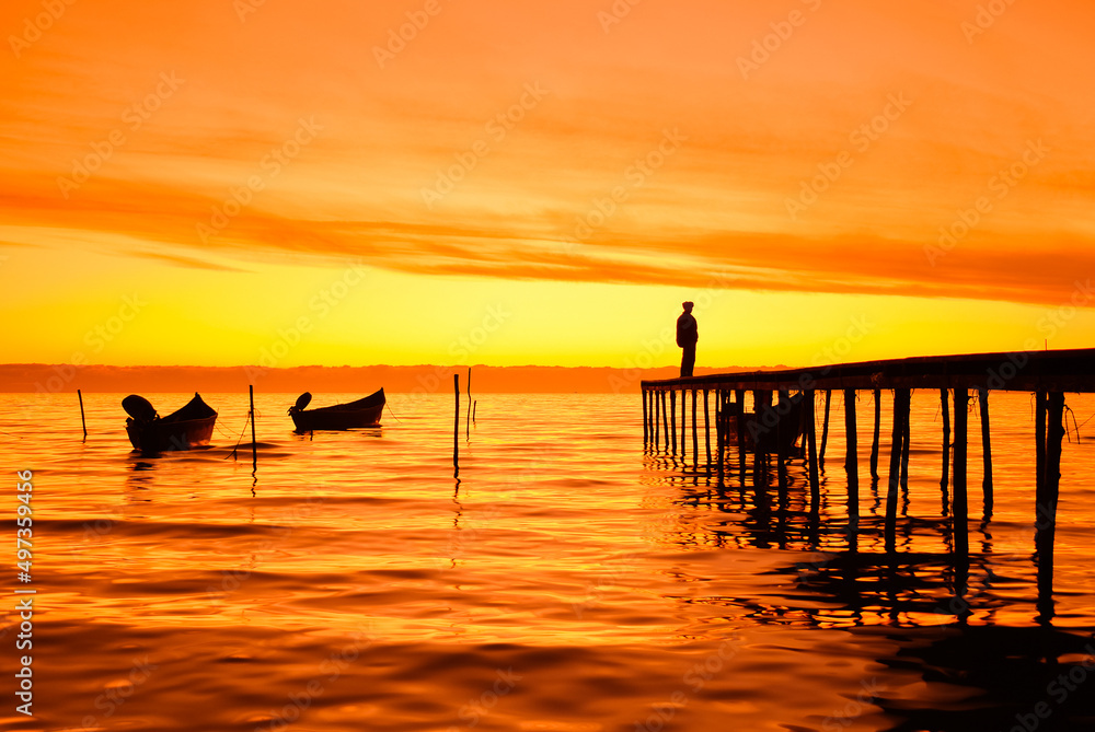 fishing boats at sunrise on the shores of Lake Razim