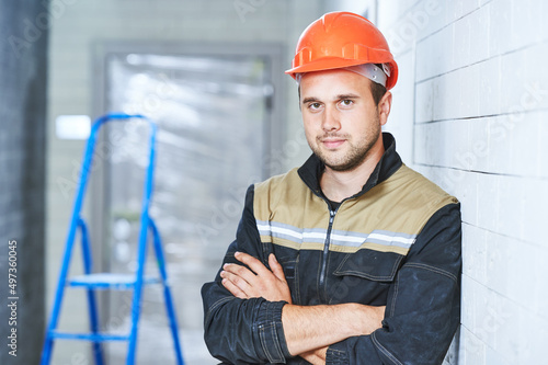 construction worker portrait indoors. Concept of building or service employee photo