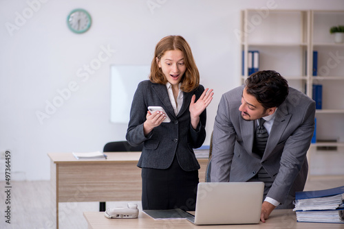 Two colleagues working in the office