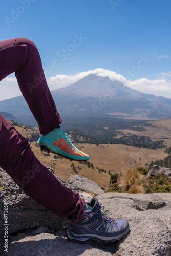 feet with soccer shoes and mountain boots